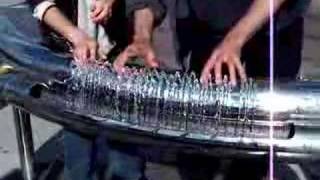 Two people playing hydraulophone water pipe organ flute [upl. by Catt863]