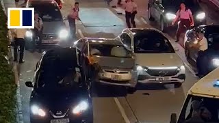 Driver tries to smash past Hong Kong roadblock in viral video [upl. by Barimah209]