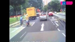 Man on motorised bicycle recklessly switches lanes [upl. by Axela310]