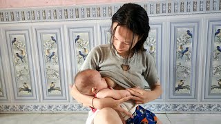 15 year old single mother holds her baby watching the rain and breastfeeding [upl. by Ferde300]