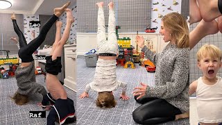 Pregnant Hilaria Baldwin stands on her HEAD as she practices yoga with her sons [upl. by Cooperstein]