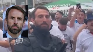 England fans sing to Gareth Southgate lookalike German policeman Southgate You’re The One [upl. by Baynebridge89]