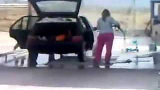 Stupid woman showing how NOT to wash your car inside [upl. by Htnicayh299]