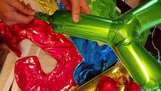 Deflating a foil balloon  use a long straw [upl. by Ailekat]