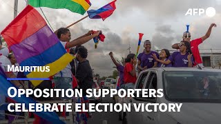 Mauritius opposition supporters celebrate an expected election victory  AFP [upl. by Ranson]