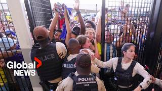 Copa America Ticketless fans climb through air vents over fence in attempt to get in stadium [upl. by Biddy7]