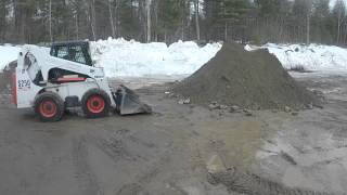 Bobcat S250 Pushing Up Pile [upl. by Cheryl931]