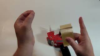 How to add a roll of tape to a tape dispenser [upl. by Hutchison]