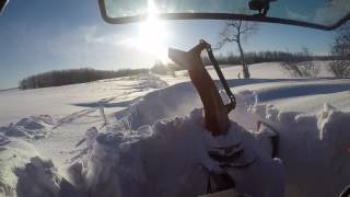 Hardcore snow blowing 6 foot deep snow drifts with the massey ferguson 4609 [upl. by Eilloh]