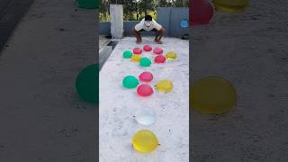 The balloon man pops water balloons randomly funny trending balloon race challenge games [upl. by Eiffe]