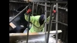 Laughing colleagues watch as builder nearly swept away by Storm Emma [upl. by Hsara]