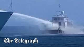 Chinese ships fire water cannons on Philippine resupply vessels in South China Sea [upl. by Haggerty]