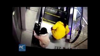 Boy saved by passersby in escalator scare in SW China [upl. by Assirrak381]