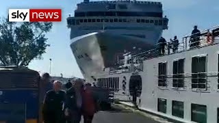 Cruise ship crashes into dock and tourist boat in Venice [upl. by Nnylirej]