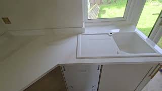 Calacatta Gold 30mm kitchen worktop with hob splashback and upstands was fitted in Walberton [upl. by Shaylyn]