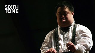 He’s Chinas Most Famous Conductor He Also Has Down Syndrome [upl. by Airual]