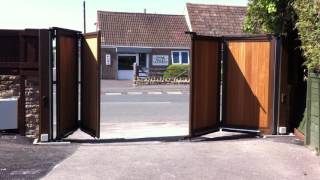 Automated Wooden Infill Bi folding Gates  The Electric Gate Company [upl. by Telimay637]