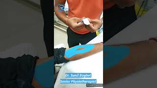 Tennis elbow treatment How do you wrap your elbow with KT Tape tenniselbowtaping drsunilphysio [upl. by Eldreeda]