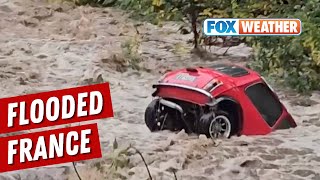 Raging Floods Send Mini Cooper Tumbling Downstream In France [upl. by Ginsburg34]