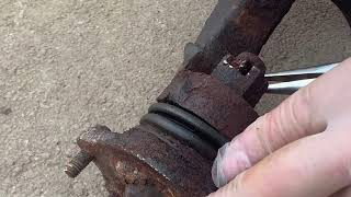 How to remove a stuck cotter pin from a ball joint castle nut [upl. by Kcirtemed196]