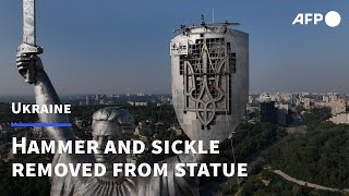 Ukraine puts trident in place of Soviet emblem on tallest statue  AFP [upl. by Goles]