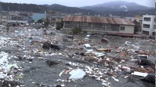 Tsunami in Kesennuma city ascending the Okawa river [upl. by Nossah]