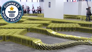 Crazy Book Dominoes  Guinness World Records [upl. by Lamarre938]