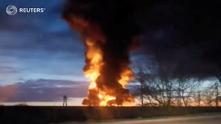 Fire after Ukraine drone attacks Russian oil depot  REUTERS [upl. by Mycah]