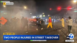 Video shows Dodge Charger crashing into group of spectators during street takeover in Anaheim [upl. by Fiden]