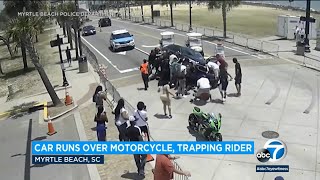 Video Onlookers police rush to rescue motorcyclist trapped beneath car in Myrtle Beach l ABC7 [upl. by Netsriik]