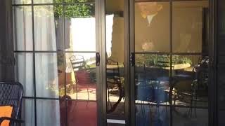 Double sliding doors with a Patio link pet door Insert installed [upl. by Nored]