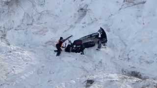 Snowmobile Hits Rider as it Rolls Down Hill  JUST SNOWMOBILES [upl. by Alroy]