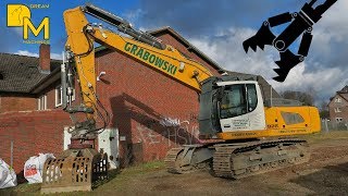 House Demolition with modern hydraulic excavator LIEBHERR 926 tearing down old house 1 [upl. by Aonian]