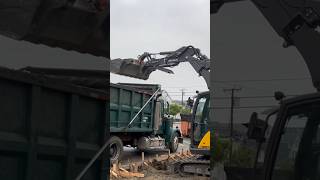 Mecalac Excavator in skid steer mode loading dump truck ￼￼short excavator skidsteer mecalac [upl. by Rise919]