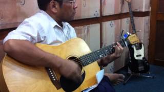 Zaw Myo Htut tuning an acoustic guitar [upl. by Notsirk410]