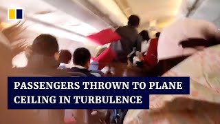 Passengers in China thrown to plane ceiling in turbulence [upl. by Stella]