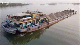 Barge carrying goods on the river passing through the dam by the ship lift system [upl. by Lalad]