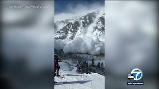 Massive avalanche sends powder cloud over skiers in Utah ski resort [upl. by Ynaffets]