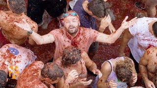 La Tomatina  Festival Discoveries  World Nomads [upl. by Anawk]