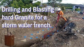 Drilling and Blasting hard Granite for a storm water trench [upl. by Arodoeht]