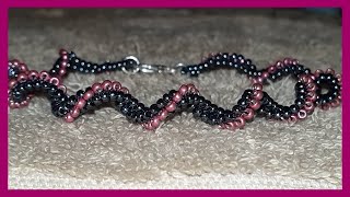 Bracelet spiral noir et magenta [upl. by Cawley686]