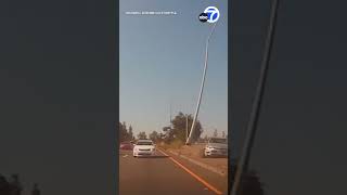 Streetlight snaps off flies through air during crash on NorCal highway [upl. by Atenaz]