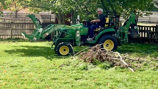 John Deere 2025R attaching backhoe amp grapple [upl. by Maddox]