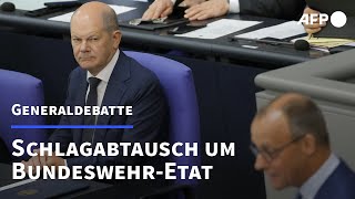 Merz und Scholz liefern sich Schlagabtausch um BundeswehrEtat  AFP [upl. by Anaihr]