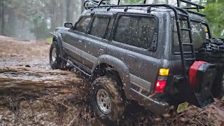 Axial SCX10 II  Toyota Land Cruiser LC80  rainy day forest rock crawling ASMR [upl. by Horatia509]