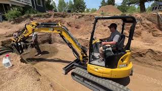 Augering holes for a greenhouse in Divide Colorado mountainliving greenhouse selfsufficient diy [upl. by Anilehs]