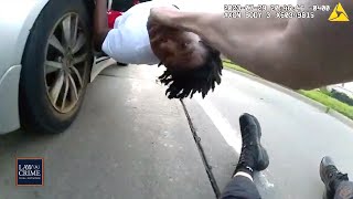 Bodycam Getaway Driver Drags Cop After Teen Suspect Hops in Back Seat During Foot Chase [upl. by Riamu]