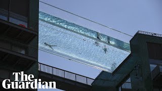 Londoners cool off in sky pool suspended 115ft in the air between two buildings [upl. by Nosirrah795]