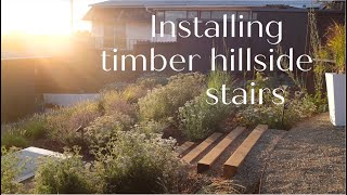 Installing landscape timber hillside stairs [upl. by Htelimay]