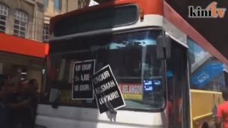 Passing bus plastered with antiNajib posters [upl. by Annovaj]